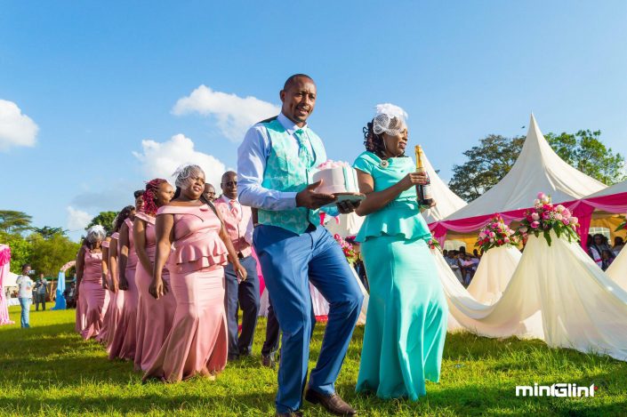 The Bridal party led by the best man and best maid dancing at the wedding reception