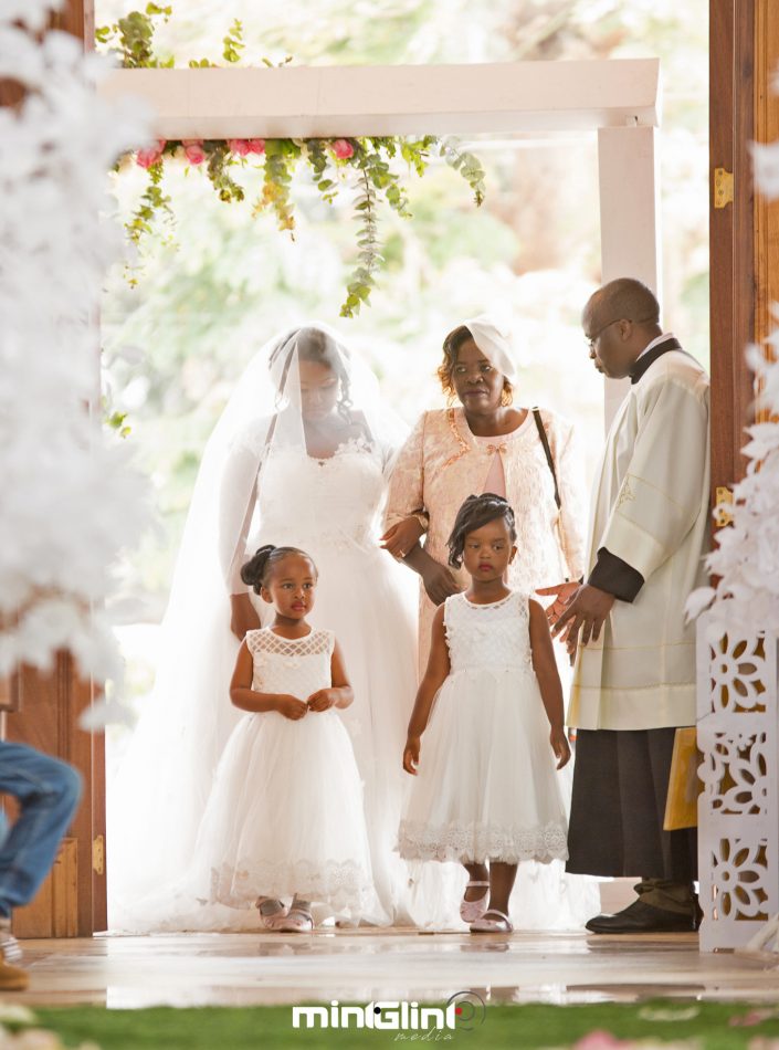 Wedding Photography, the bride walking down the isle with flower girls