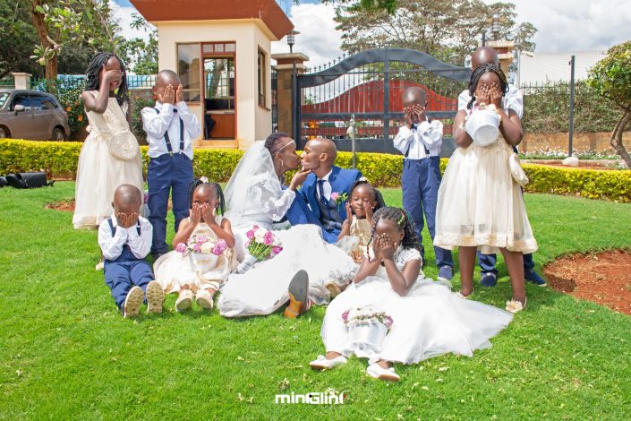 Wedding Photography by Mint Glint Media; The Groom and Bride with their Pageboys and flower girls