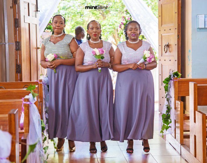 Bridesmaids dancing down the isle ; Wedding photography by Mint Glint Media