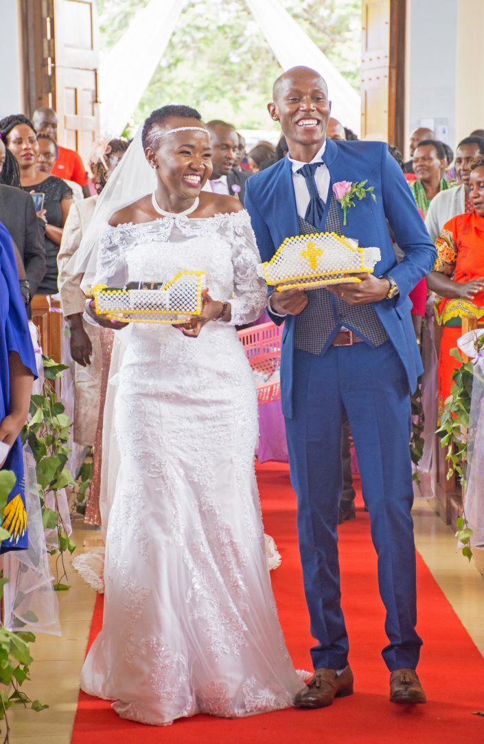 Bride and Groom carrying Host and Wine; Wedding photography by Mint Glint Media