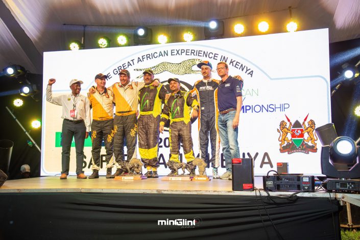 Baldev Chager and his navigator Ravi Soni alongside the first and second runners-up celebrate their win of 2019 Safari Rally to the right is Oliver Ciesla - Managing Director - WRC Promoter GmbH and to the left is Phineas Kimathi the CEO of Safari Rally Project in Kenya.