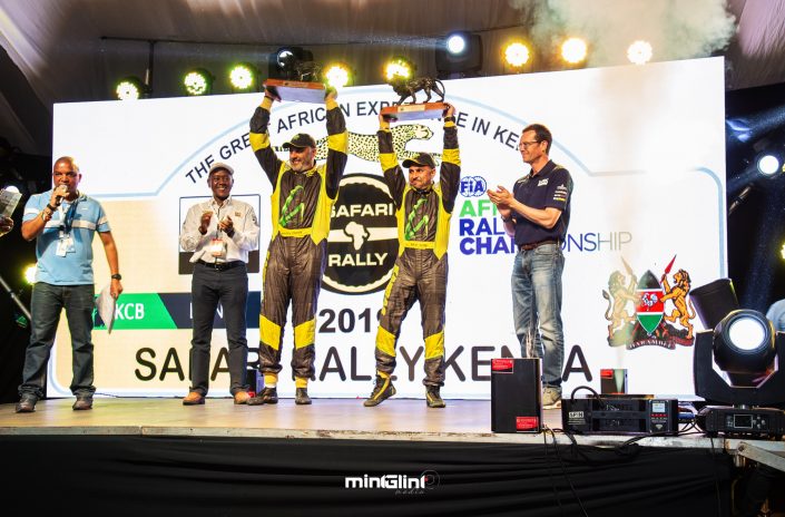 Baldev Chager and his navigator Ravi Soni celebrate their win of 2019 Safari Rally to the right is Oliver Ciesla - Managing Director - WRC Promoter GmbH and to the left is Phineas Kimathi the CEO of Safari Rally Project in Kenya.