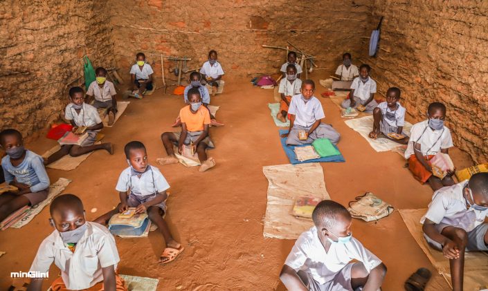 Documentary Photography- Pupils of Tandai Primary in Kilifi in their Mud-walled classroom seated on mud floor without desks.