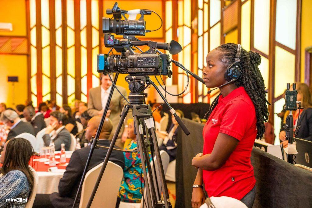 Camera operator at a corporate event.